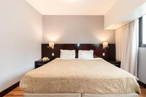 Ένα ή περισσότερα κρεβάτια σε δωμάτιο στο A1 Flats WYM Brooklin