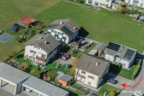 an aerial view of a house with a yard at casa Battilana Li Curt - Poschiavo in Prada