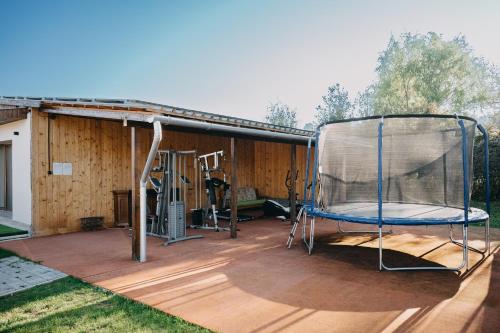 a covered deck with a gym with a gym at Natura vendégház in Abaújvár