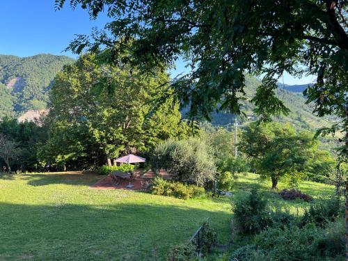 a garden with a gazebo in the middle of a field at La Melagrana in Brisighella