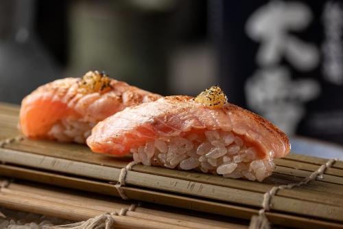 two pieces of sushi sitting on top of a table at Grand Hyatt Rio de Janeiro in Rio de Janeiro