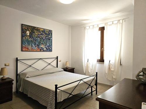 Ένα ή περισσότερα κρεβάτια σε δωμάτιο στο Matteo's Apartments