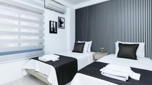 En eller flere senge i et værelse på Kalkan 2 Bedroom Apartment 7408