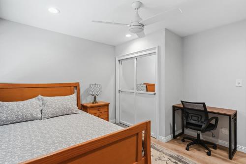 a bedroom with a bed and a desk and a chair at Peaceful Getaway with Renovated Amenities in San Diego