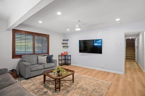 a living room with a couch and a table at Peaceful Getaway with Renovated Amenities in San Diego