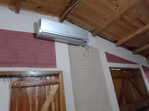 a light hanging from the ceiling of a room at Apartment in Posadas in Posadas