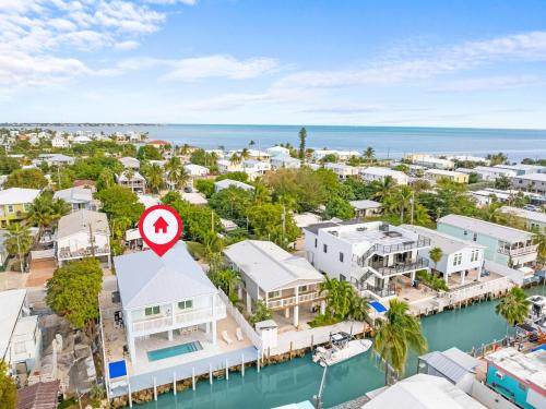 an aerial view of a coastal town with houses and the ocean at Azul Paradise - Waterfront - Heated Pool - Dock in Marathon