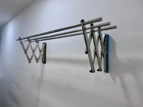 a row of metal railings on a white wall at MetroCity Square Condominium-3R2B-9 Pax in Kuching