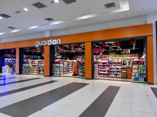 a grocery store aisle with aoglium sign in a store at MetroCity Square Condominium-3R2B-9 Pax in Kuching