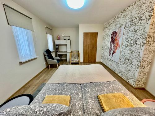 a room with a bed and a table in it at Japandi apartamentai in Kaunas