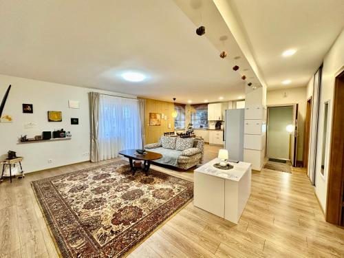 a living room with a couch and a table at Japandi apartamentai in Kaunas