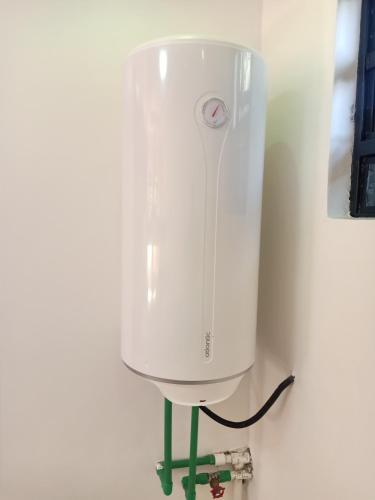 a white blender sitting on a stand in a room at Camp William's - A dreamer's paradise in Kiambu in Kanyore