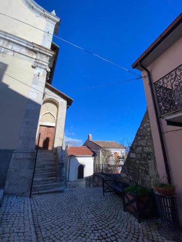 a cobblestone street in front of a building at Don Pasquale Scontrone House in Scontrone