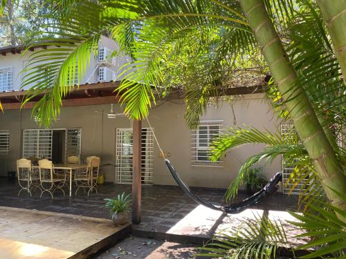 a hammock in the courtyard of a house at Casa Quinta Guacaras in Santa Ana