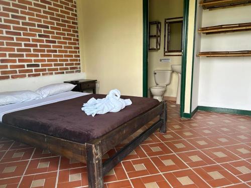 Postel nebo postele na pokoji v ubytování FINCA HOTEL TRADICION CAFETERA