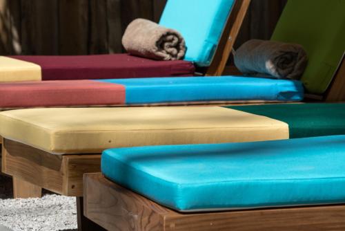 a group of three mattresses sitting next to each other at The Beach Break Hotel and Surf Club by Tierra Magnifica in Nosara