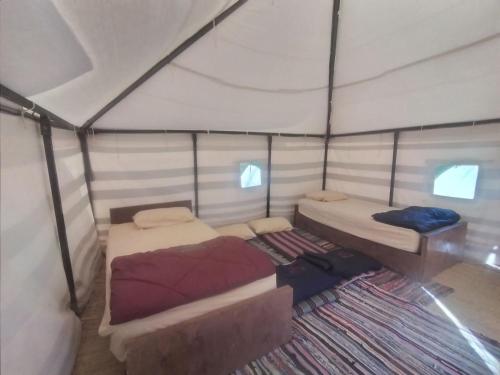Voodi või voodid majutusasutuse Camp Qasoor toas