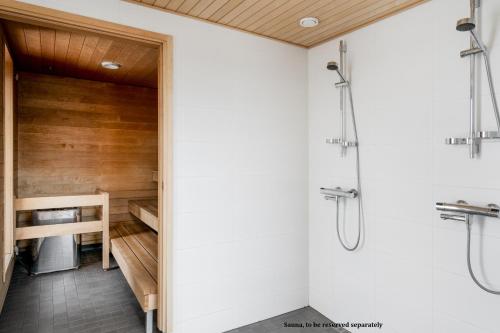 a bathroom with a shower and a sink at Modern 1BR Apartment with Balcony at Tripla Pasila, 5 mins to Helsinki City Center in Helsinki