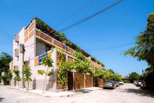 a building with ivy on the side of it at Casa 2 Punta de mita in Punta Mita
