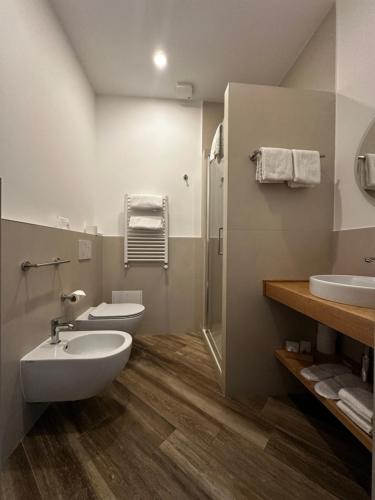 a bathroom with a sink and a toilet and a shower at All Comfort Astoria Palace in Rome