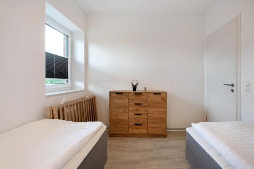 Postel nebo postele na pokoji v ubytování Ferienhaus Flut