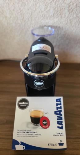 a cup of coffee sitting on top of a box at Dvor in Donja Toponica