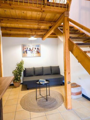a living room with a couch and a table at Agriturismo Ca du Chittu in Carro