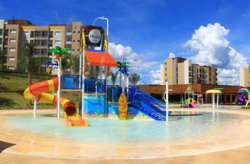 a water park with a water slide in the water at Praias do Lago in Caldas Novas