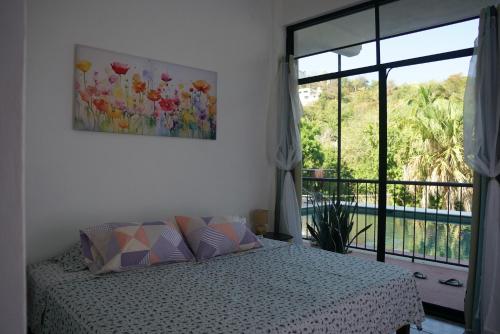 Ένα ή περισσότερα κρεβάτια σε δωμάτιο στο Casa Esperanza