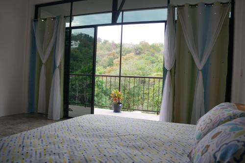 Ένα ή περισσότερα κρεβάτια σε δωμάτιο στο Casa Esperanza