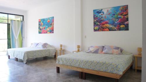 Ένα ή περισσότερα κρεβάτια σε δωμάτιο στο Casa Esperanza
