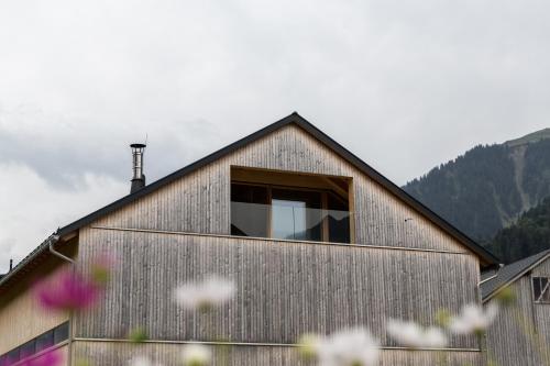 a house with a window on the side of it at Beerenhus in Au im Bregenzerwald