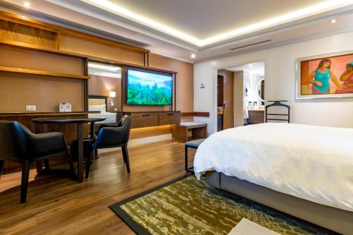 Postel nebo postele na pokoji v ubytování Hotel Lucerna Mexicali