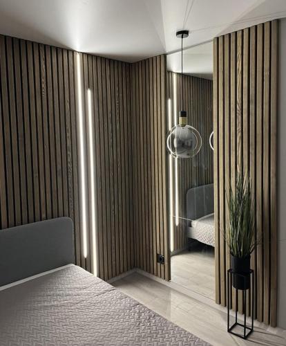 Ένα ή περισσότερα κρεβάτια σε δωμάτιο στο LUX Apartamentai