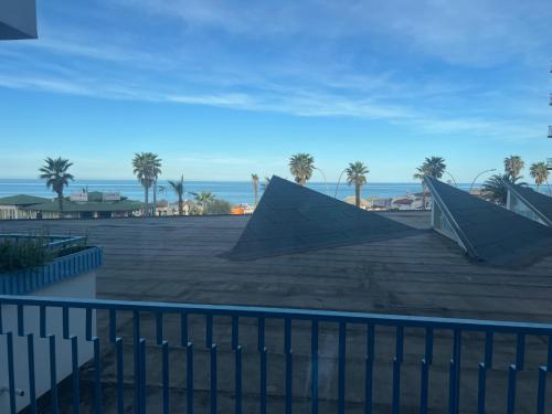 a view of the ocean from the roof of a building at Majson EJ in Civitanova Marche