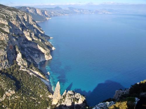 an aerial view of the ocean on a mountain at B&B Sa Clarera in Baunei