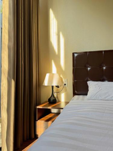 Postel nebo postele na pokoji v ubytování Q Garden Homestay