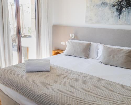 Postel nebo postele na pokoji v ubytování Ynaira hotel & Spa