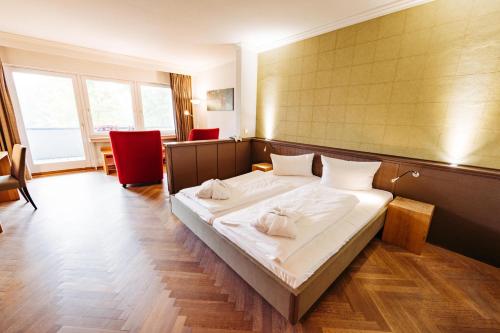 a bedroom with a bed with two white pillows on it at Berghotel Hoher Knochen - Ruhe & Natur in Winterberg