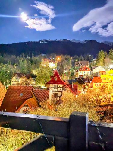 a view of a town with houses and buildings at Vila Ferdinand Apartments in Sinaia