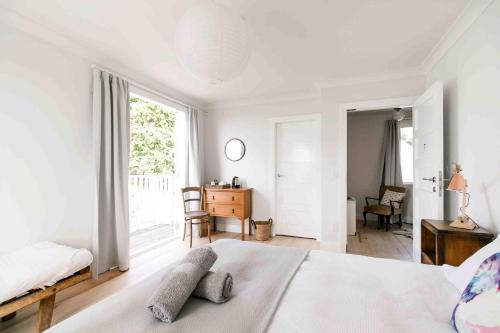 a bedroom with a bed with two pillows on it at The Pear Orchard Lodge in Richmond
