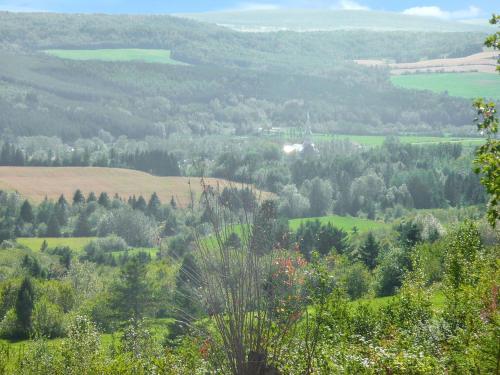 a view of a valley with trees and fields at Comfortable apartment Sainte-Angèle-de-Mérici 80 m² balcony! in Sainte-Angèle