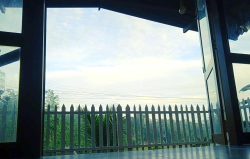 a view of a fence from a sliding glass door at Cinnamon Hills Cabana in Alutwala