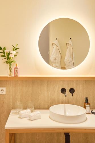 a bathroom with a sink and a mirror at MS Collection Arouca - Mosteiro de Arouca in Arouca