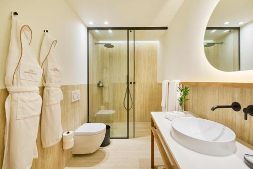 a bathroom with a sink and a toilet and a shower at MS Collection Arouca - Mosteiro de Arouca in Arouca