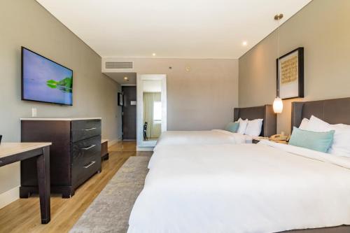 Hotel Lucerna Hermosilloにあるベッド