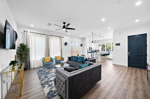 a living room with a couch and a table at Cozy Home Near MedCenter, Uptown, & Downtown in Houston