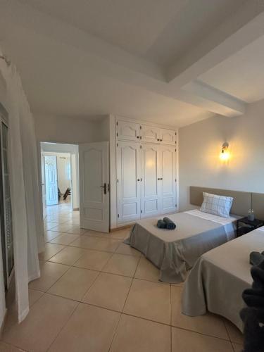 Ένα ή περισσότερα κρεβάτια σε δωμάτιο στο Travellers Guesthouse