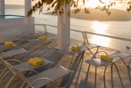 a group of chairs sitting on the deck of a cruise ship at Keti Hotel in Fira