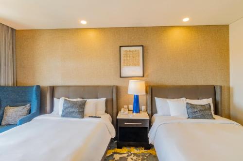 Hotel Lucerna Hermosilloにあるベッド